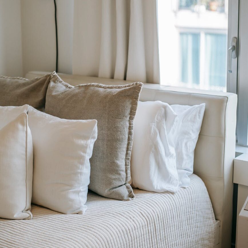 bedroom interior with soft cushions on bed at home